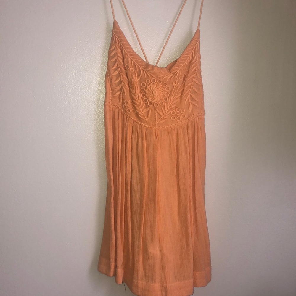 Yellow, low back flowy top